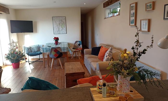 Lounge and dining area with wood burning stove
